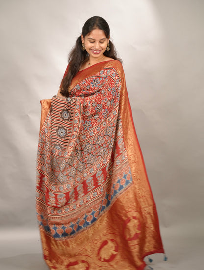 Red Ajrakh Handblock printed Dola Silk Saree | Looms & Tassels