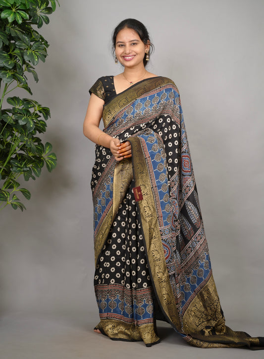 Black Ajrakh hand block print Dola silk saree by Looms & Tassels