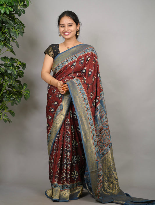 Brick red Ajrakh print Dola silk saree by Looms & Tassels