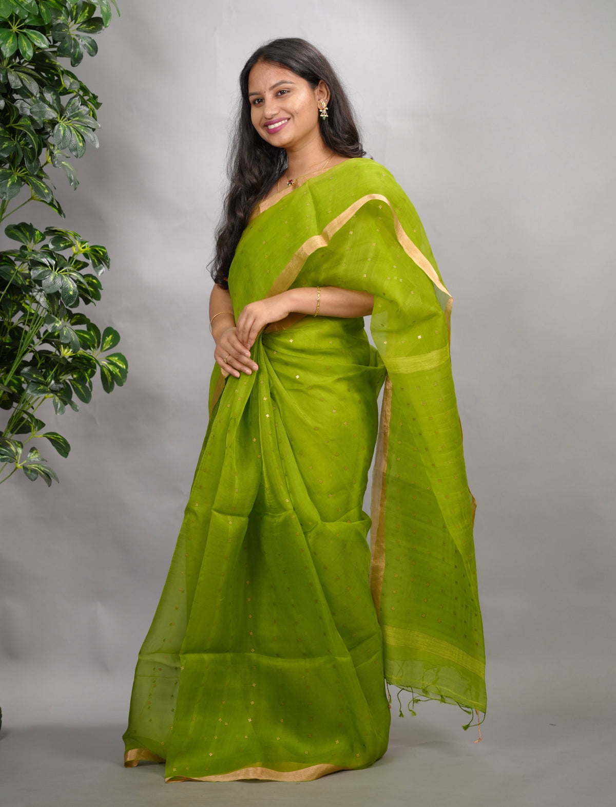 Parrot Green Handwoven Muslin Silk Saree With Sequence Work | Looms & Tassels