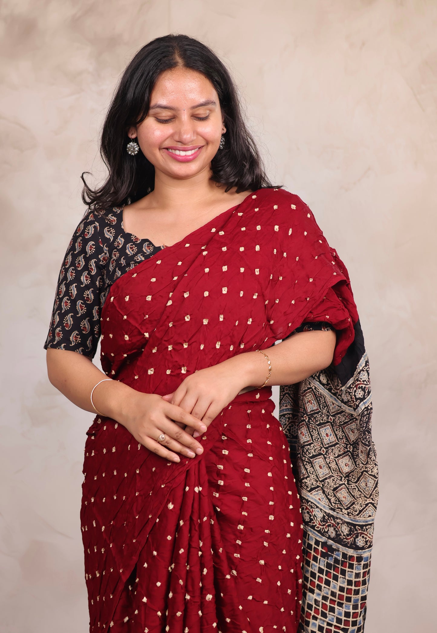 Maroon Hand Knotted Bandhej Modal Silk Saree with Ajrakh Pallu | Looms & Tassels
