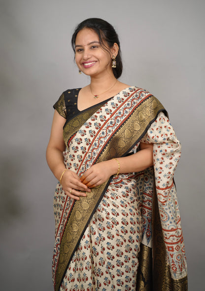 Cream Ajrakh Handblock printed Dola Silk Saree| Looms & Tassels