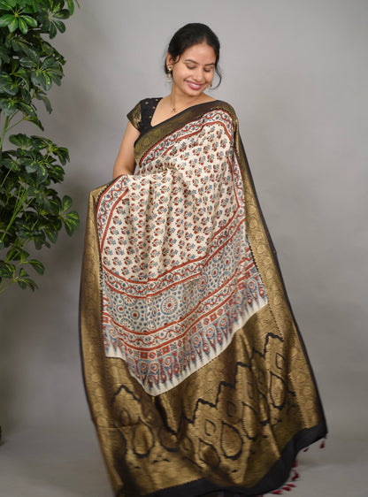Cream Ajrakh Handblock printed Dola Silk Saree| Looms & Tassels