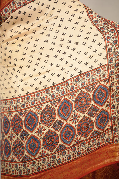 Cream Ajrakh Handblock printed Dola Silk Saree | Looms & Tassels