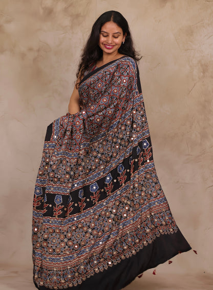 Black Handcrafted Ajrakh Modal Silk Saree with Authentic Banjara Mirror Work | Looms & Tassel