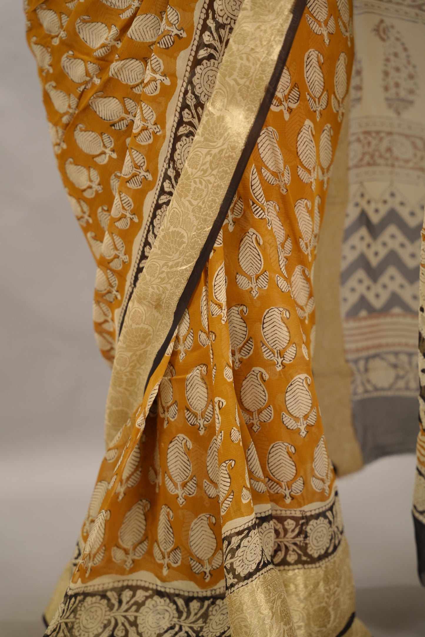 Mustard Chiffon Hand Block Printed Saree with Jari Border | Looms & Tassels