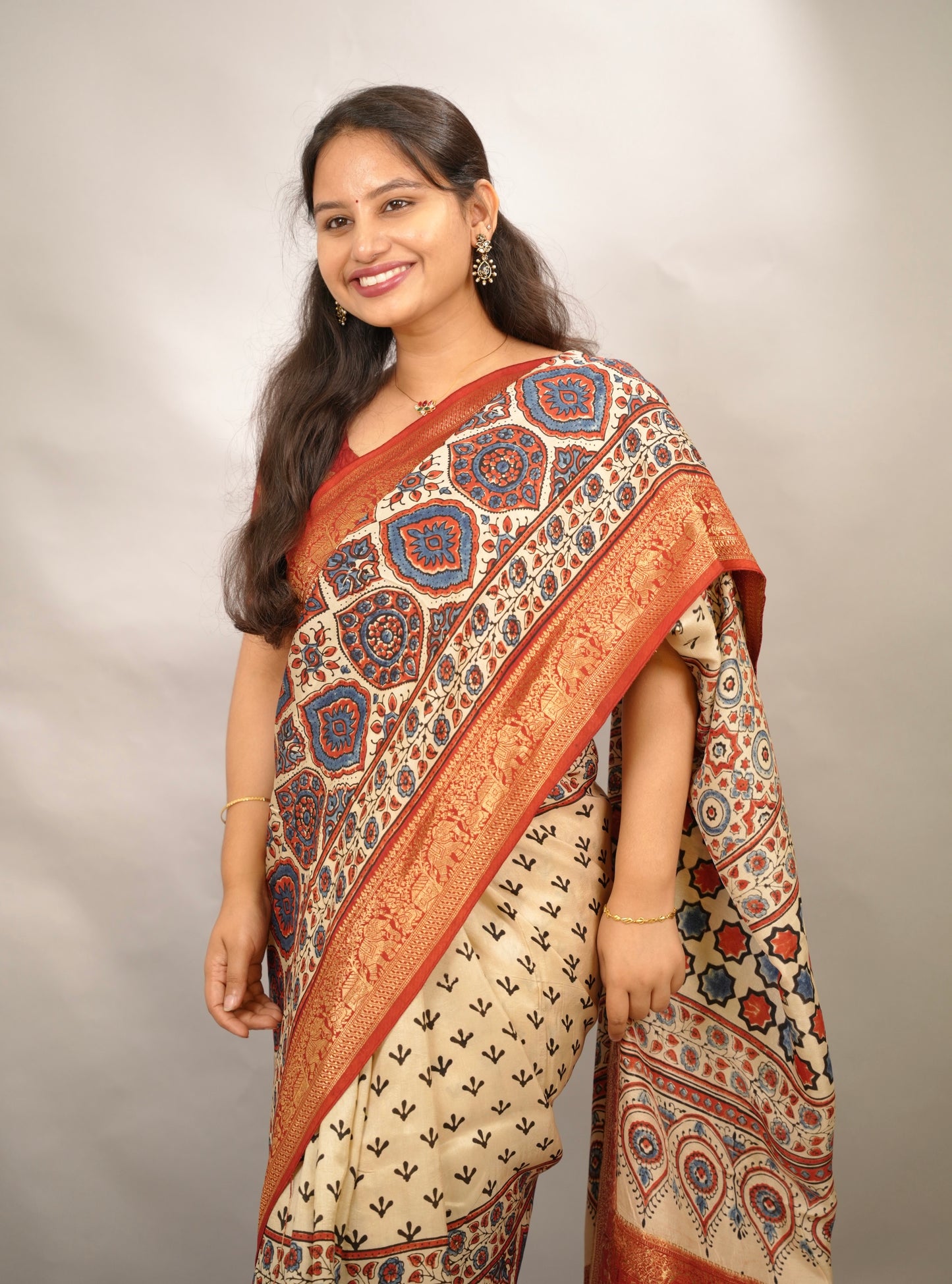 Cream Ajrakh Handblock printed Dola Silk Saree | Looms & Tassels